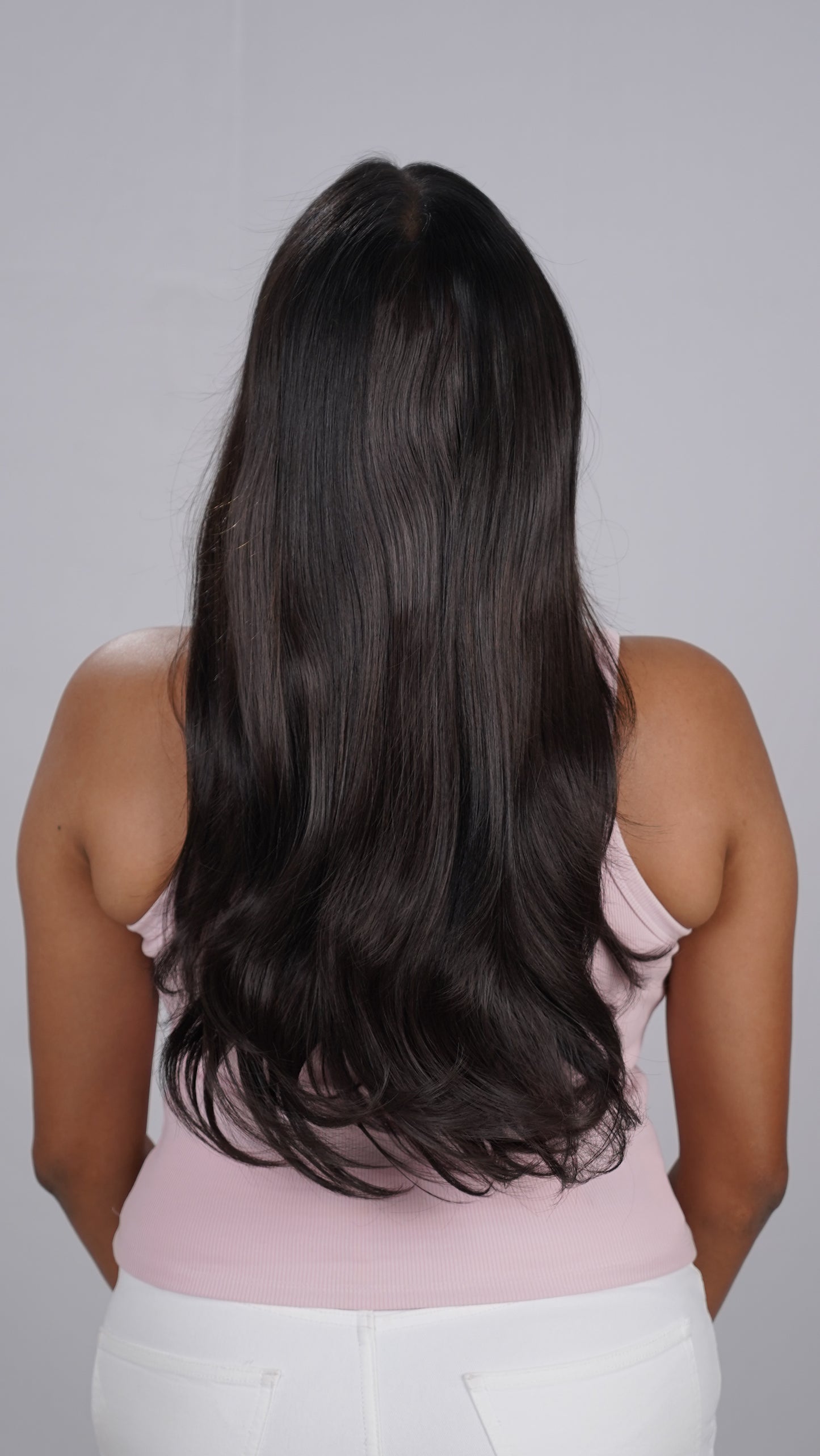 Model showing Blow Dry Wavy Total Volume salon-style extensions