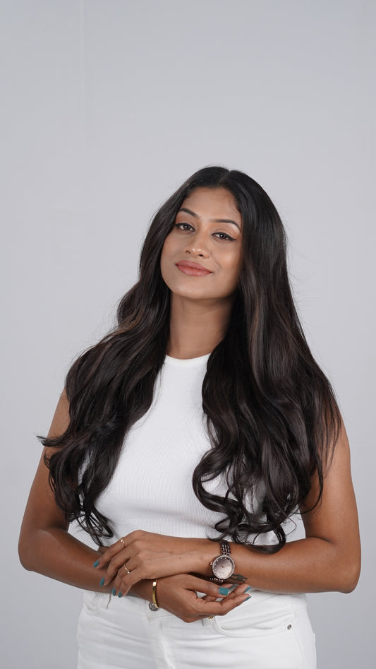 Model wearing Curly Total Volume extensions with full curls
