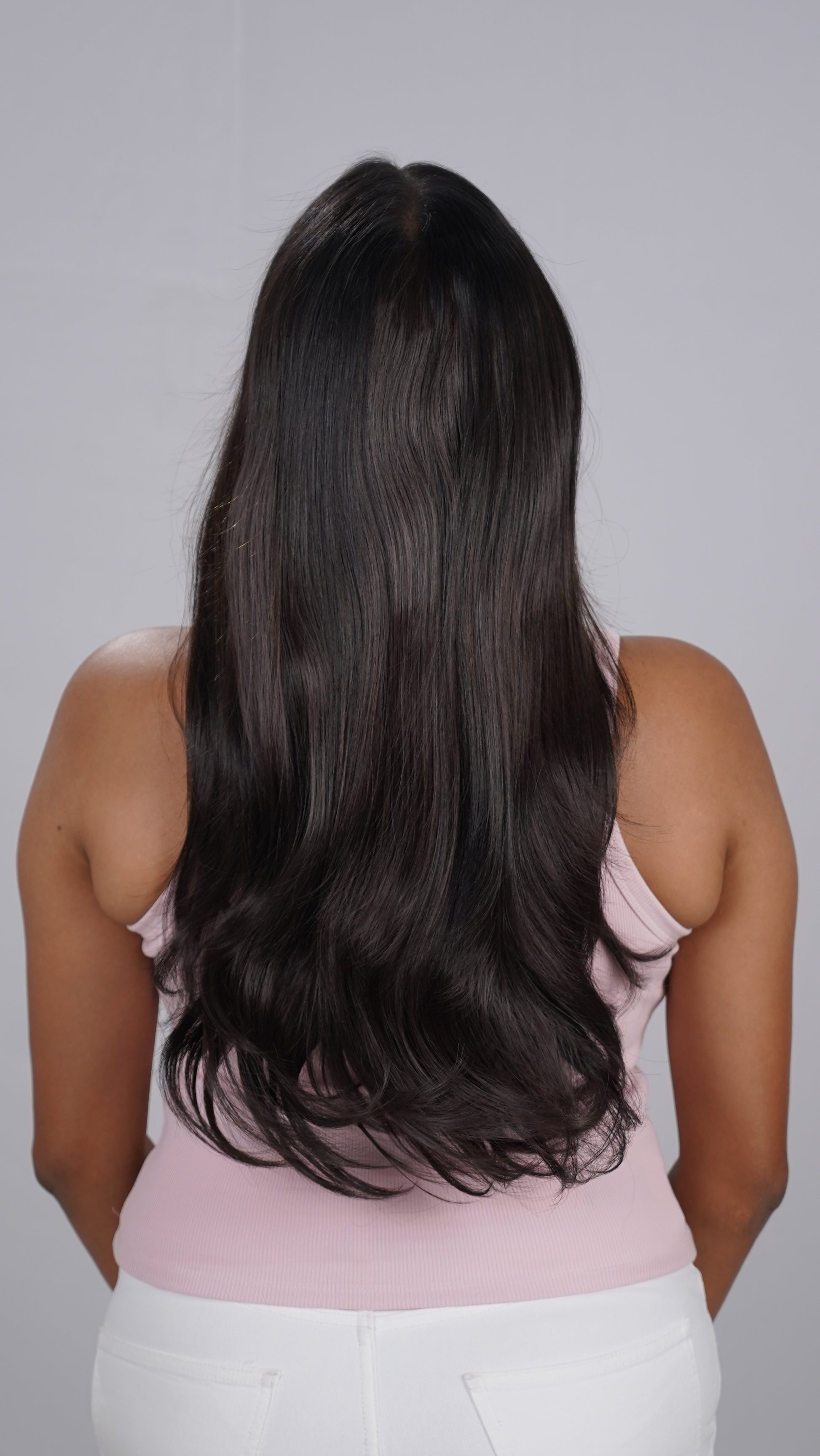 Model showing Blow Dry Wavy Total Volume salon-style extensions